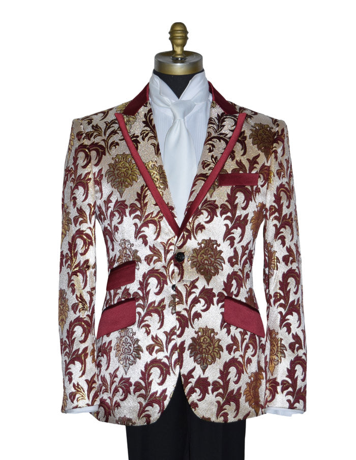 close-up mannequin wearing a champagne colored tuxedo with gold and burgundy floral pattern with a long white necktie against a white background