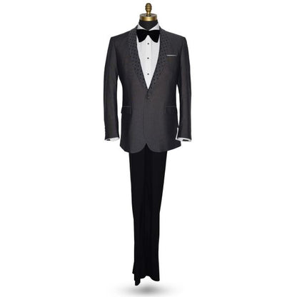 life size mannequin wearing a charcoal gray dinner jacket with a white shirt and larger black velvet bow tie on a mannequin against a white background
