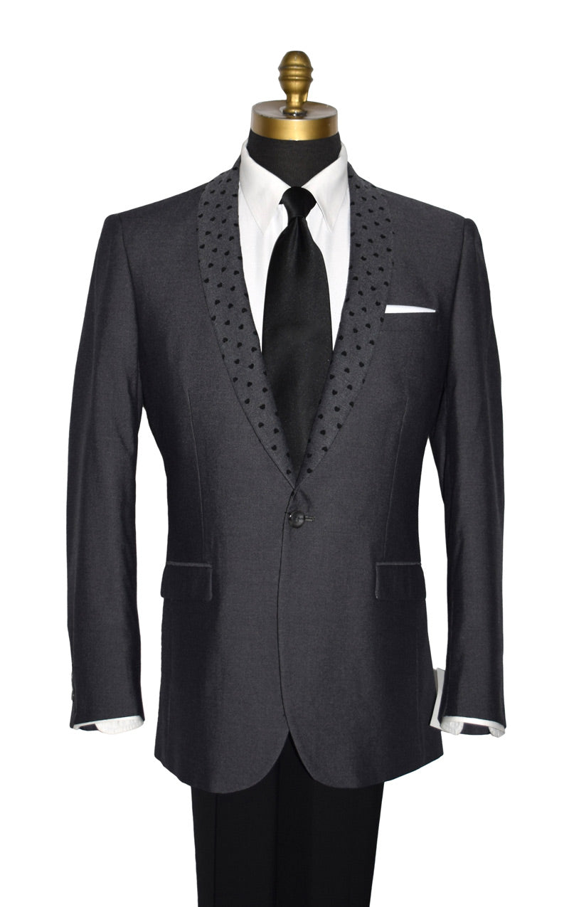 close-up front view mannequin wearing a charcoal gray dinner jacket with a white tuxedo shirt and black long neck-tie against a white background