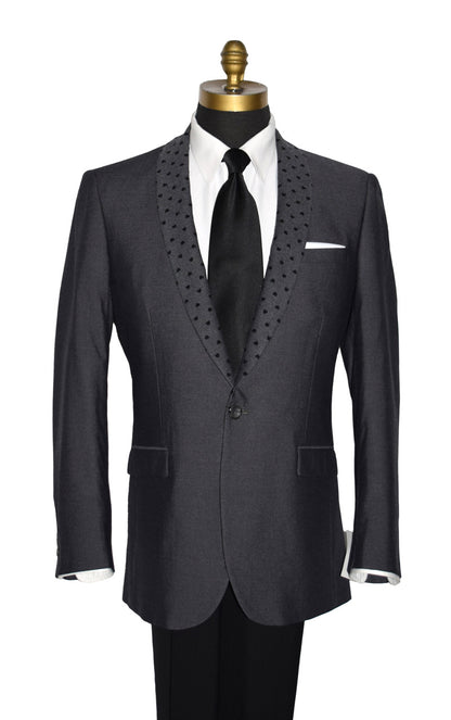 close-up front view mannequin wearing a charcoal gray dinner jacket with a white tuxedo shirt and black long neck-tie against a white background
