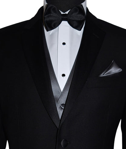 close-up front view Mannequin wearing a black notch-lapel tuxedo with a white dress shirt and a charcoal tuxedo vest with a black satin bowtie against a white background