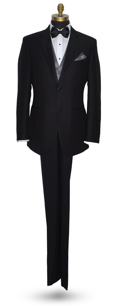 life-size mannequin wearing a black notch-lapel tuxedo with a white dress shirt and a charcoal tuxedo vest with a black satin "pre-tied" bow tie against a white background