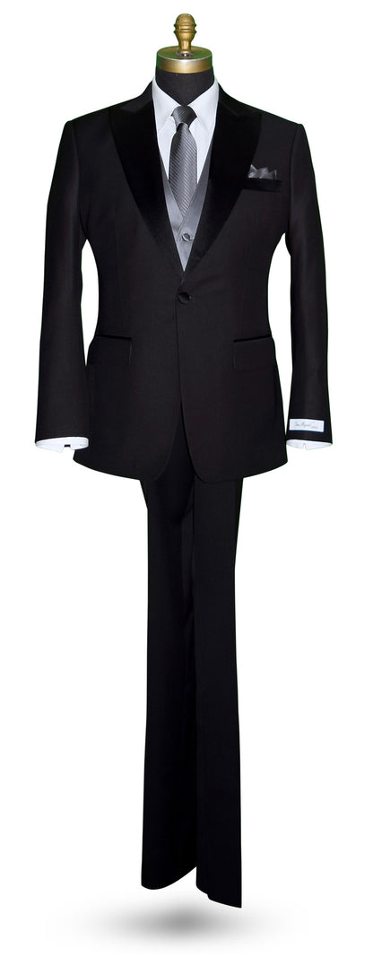 life size mannequin wearing a black peak lapel tuxedo with a white shirt and charcoal satin vest and charcoal subtle stripe necktie against a white background
