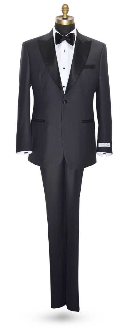 life size mannequin wearing charcoal peak lapel tuxedo with white tuxedo shirt and black bowtie