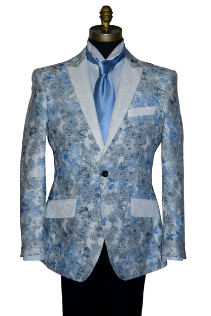 Blue floral patterned tuxedo jacket on a mannequin with a long baby-blue necktie against a white background
