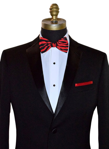 Black tuxedo with a crimson red and black zebra print bow tie on a mannequin against a white background.