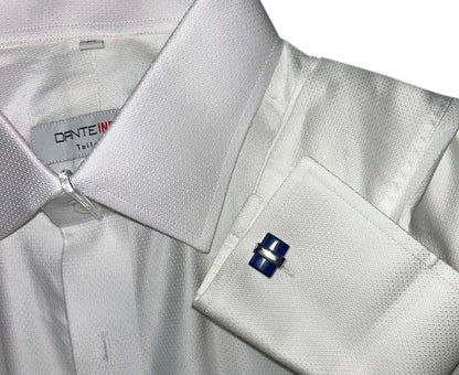 Close-up of a white dress shirt with blue and silver cufflinks on a Dante Inferno shirtl.