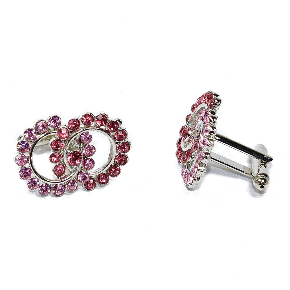 Pair of pink crystal cufflinks on a white background