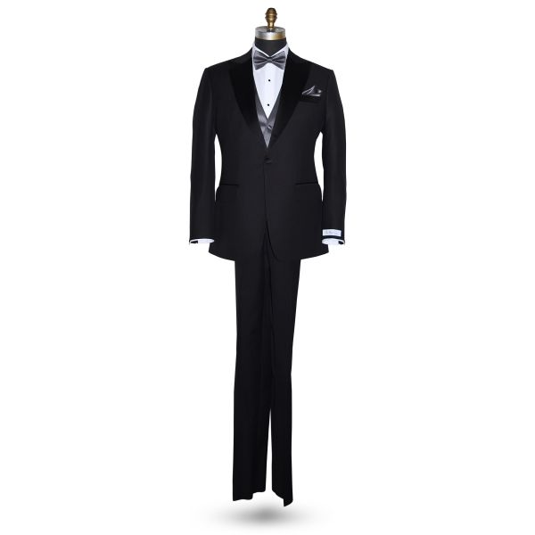 life size full mannequin wearing a black peak lapel "San Miguel Especial" tuxedo with a white tuxedo shirt with a charcoal pre-tied bowtie and charcoal vest against a white background