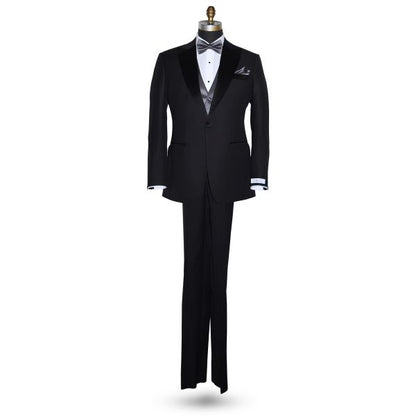 life size full mannequin wearing a black peak lapel "San Miguel Especial" tuxedo with a white tuxedo shirt with a charcoal pre-tied bowtie and charcoal vest against a white background