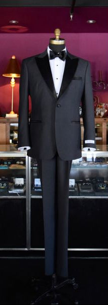 charcoal tuxedo on dislay inside fancy tuxedo shop