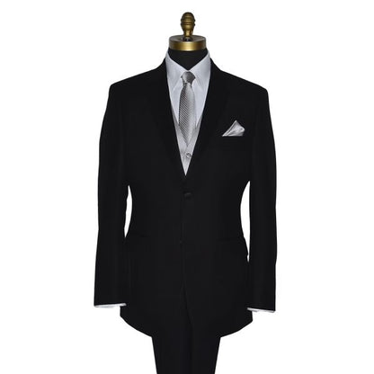 moonlight gray dress necktie with a subtle stripe pattern, displayed on a mannequin wearing a black notch-lapel tuxedo and white shirt.