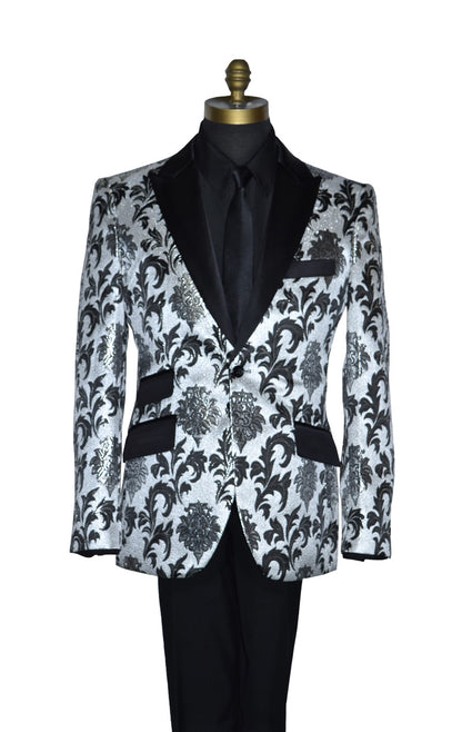 close-up silver and black tuxedo on a mannequin wearibng a black dress shirt and black necktie against a white background