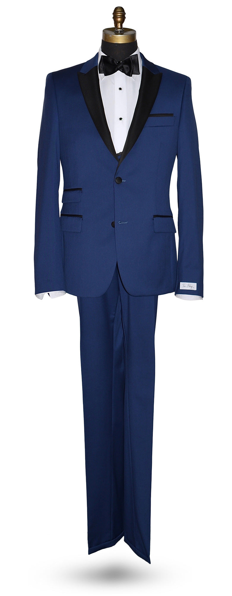 full length mannequin wearing a french blue 3 piece tuxedo and a black satin bowtie and french blue vest against a white wall 