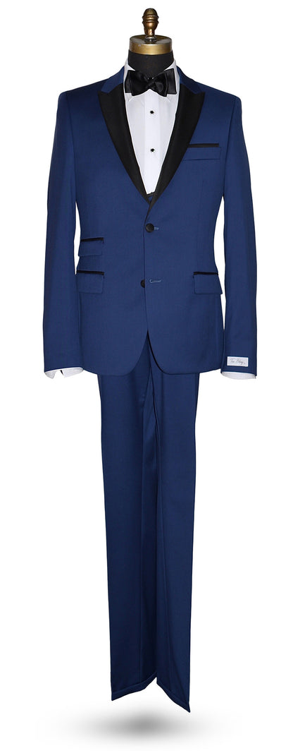 full length mannequin wearing a french blue 3 piece tuxedo and a black satin bowtie and french blue vest against a white wall 