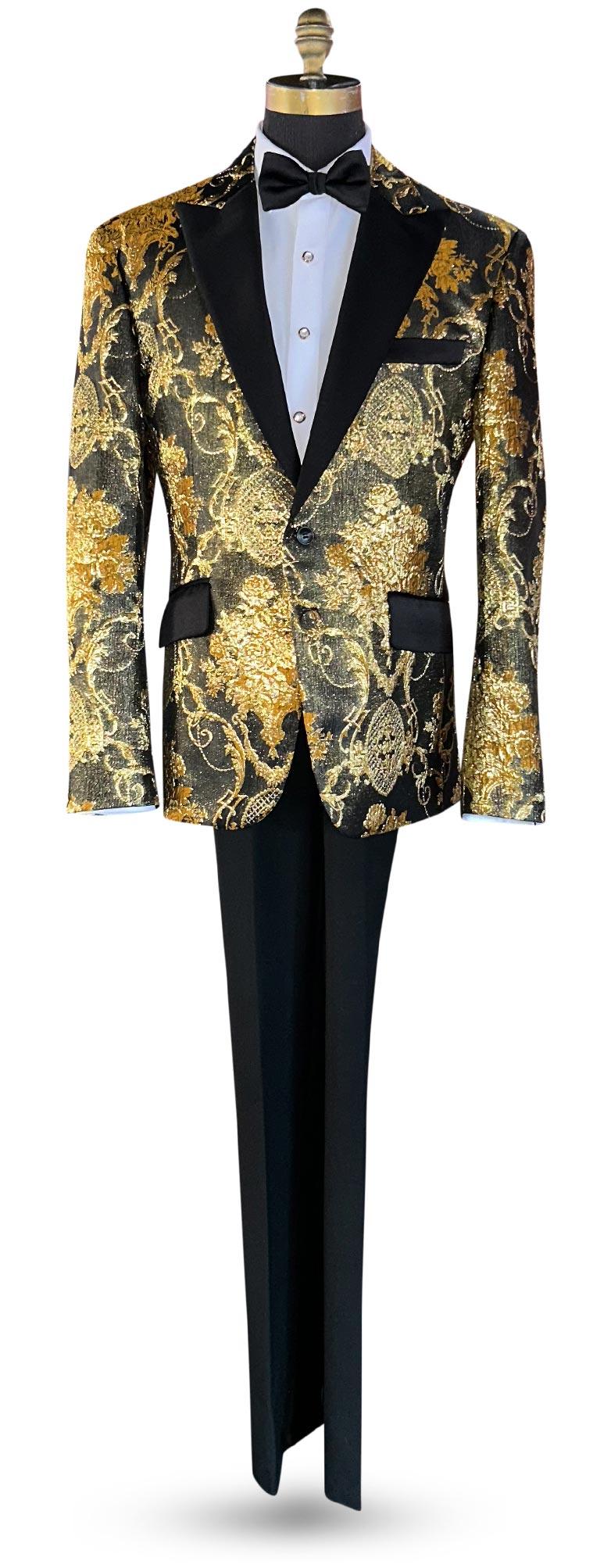Gold and black brocade tuxedo jacket with black pants on a full length mannequin against a white background