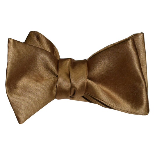 Gold "tie-yourself" bow tie on a white background
