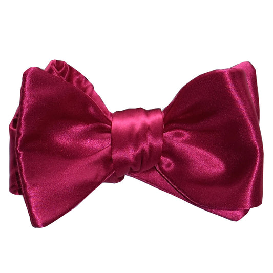 hot-pink silk "tie-yourself" bow tie on a white background