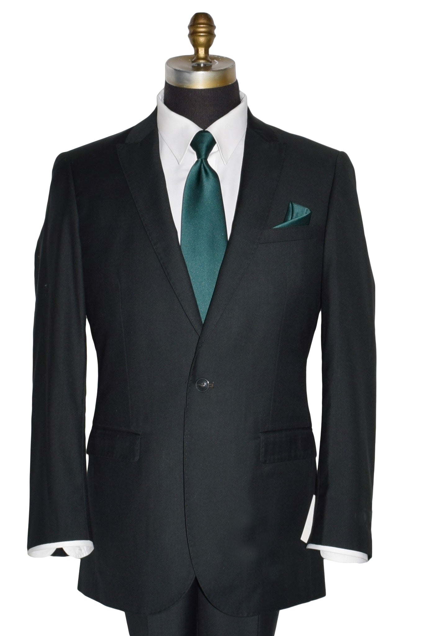 close-up mannequin wearing a men's hunter green suit coat and matching pants with a white dress shirt and green necktie in-front of a white background