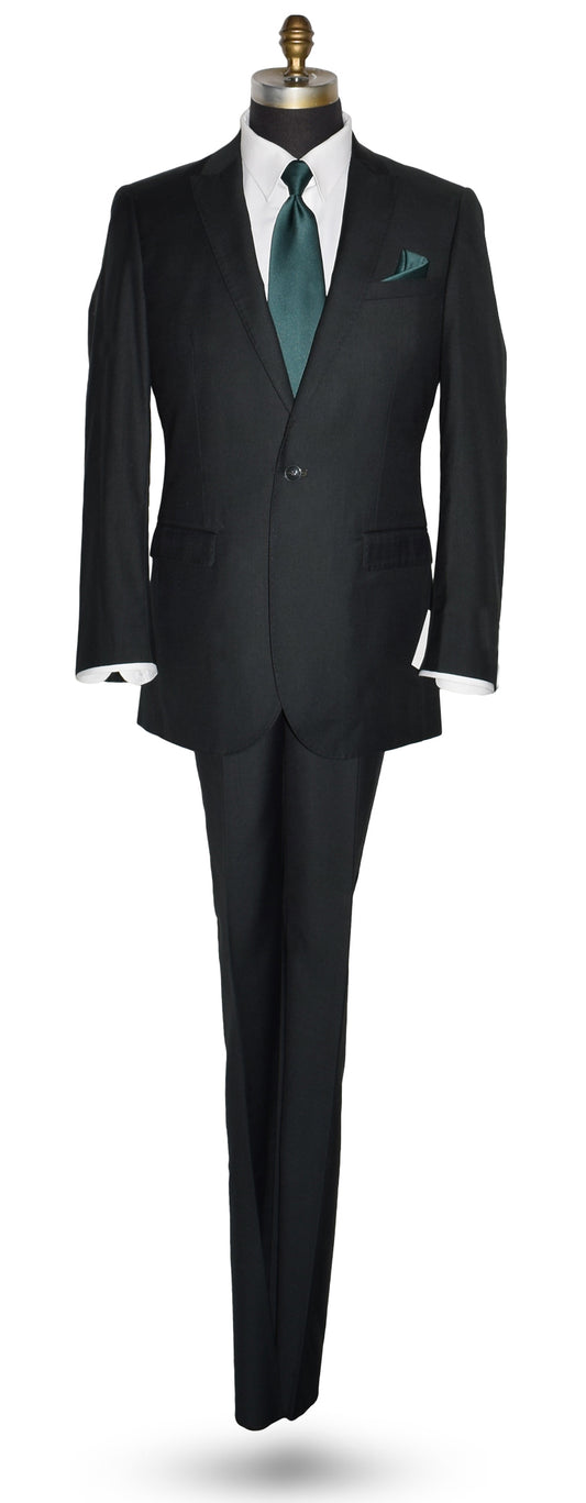Life size mannequin wearing a men's hunter green suit coat and matching pants with a white dress shirt and green necktie in-front of a white background