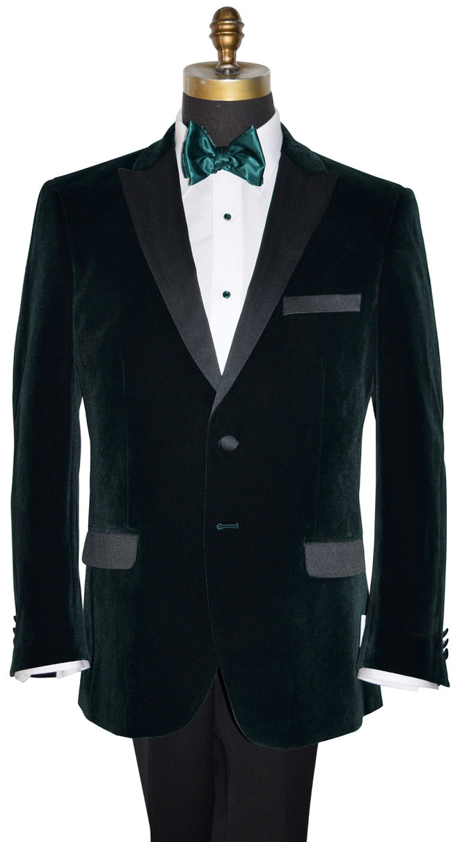 close-up mannequin wearing hunter green velvet tuxedo jacket shown with a green silk bowtie against a white background