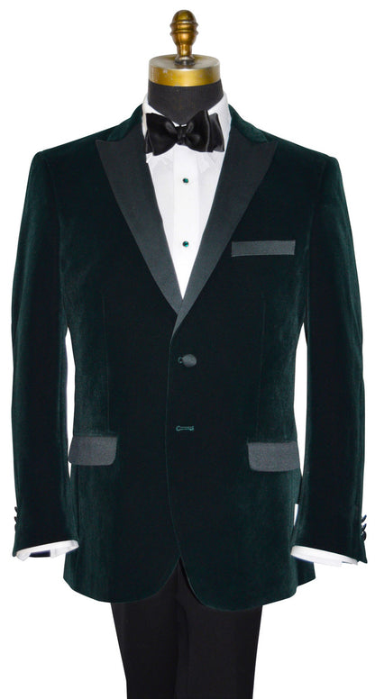 close-up mannequin wearing a hunter green velvet tuxedo jacket shown with a black bowtie against a white background