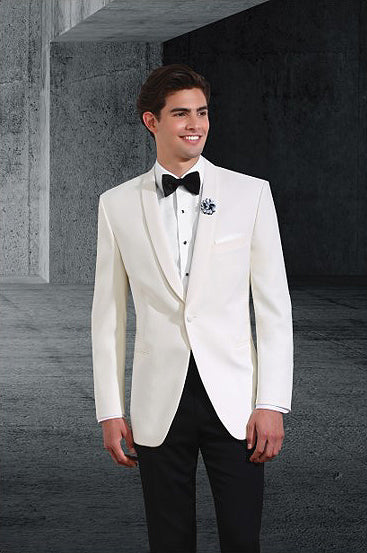 Man wearing an ivory shawl collar tuxedo with a black bow tie against a dark background