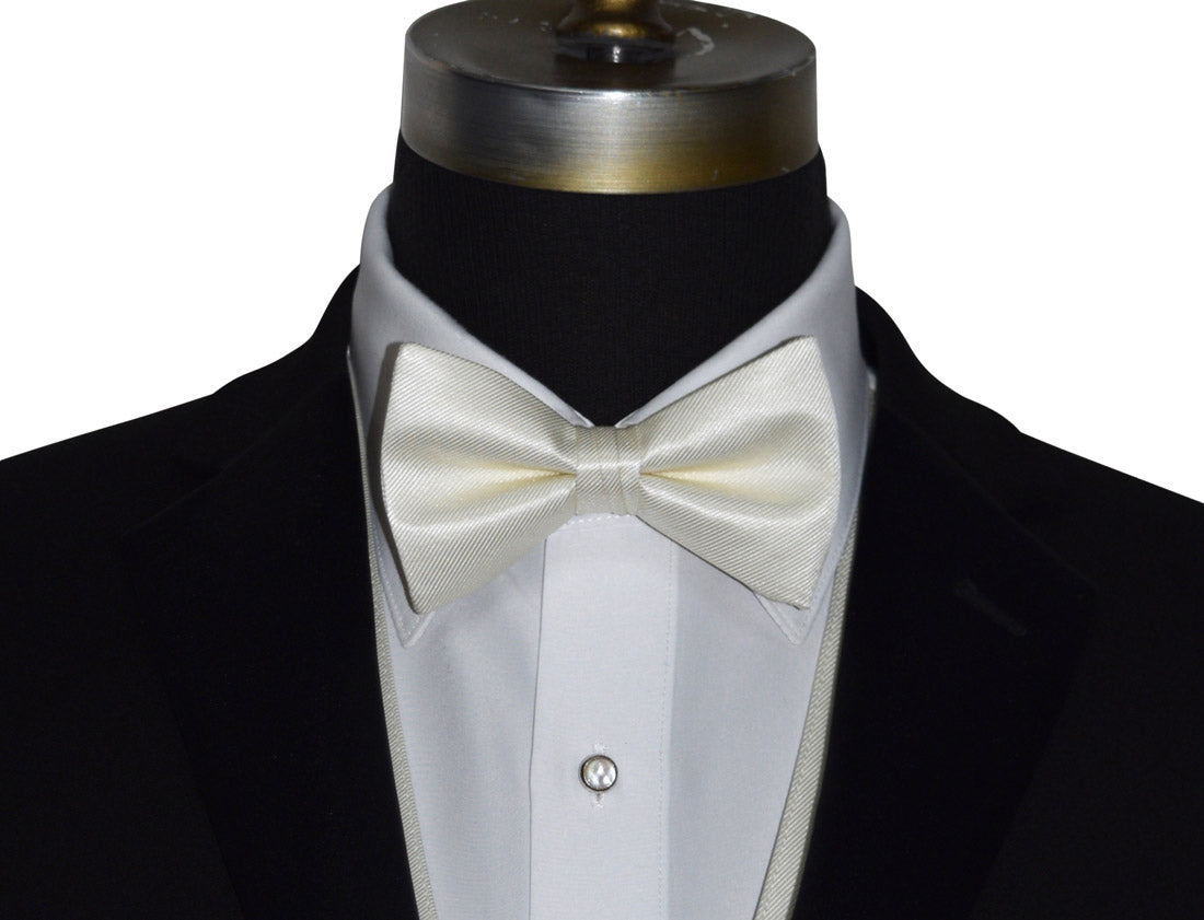 very close mannequin wearing an ivory bowtie against a white background