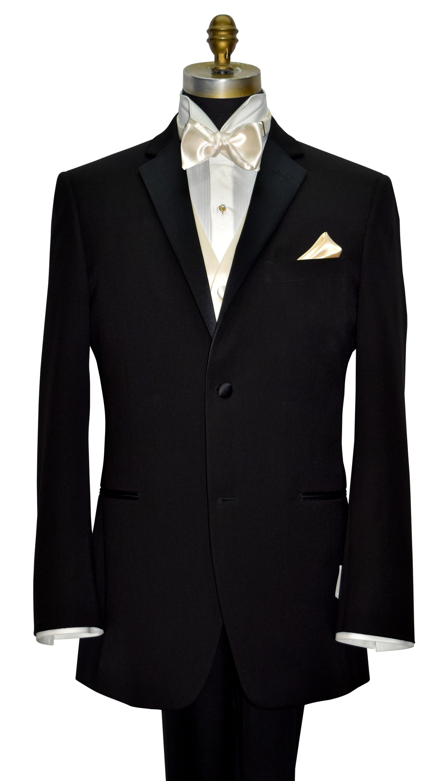 Black tuxedo with ivory shirt with an ivory satin tuxedo vest and ivory satin bow tie on a mannequin against a white background