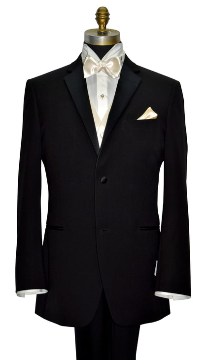 Black tuxedo with ivory shirt with an ivory satin tuxedo vest and ivory satin bow tie on a mannequin against a white background