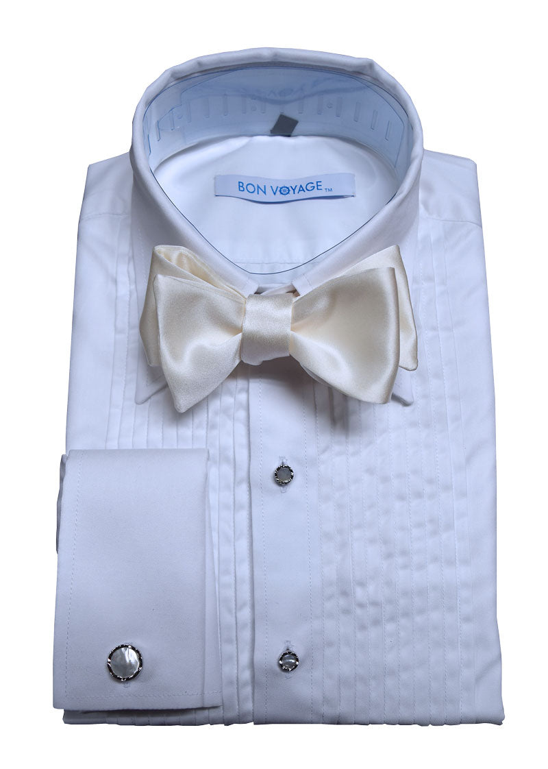 close-up white "Bon Voyage" branded tuxedo shirt wearing an ivory "self-tie" bow tie against a white background
