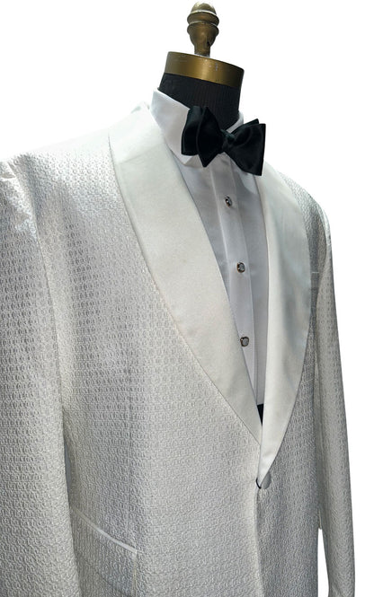 mannequin wearing ivory dinner jacket with black bowtie and pearl studs and cufflinks against a white background