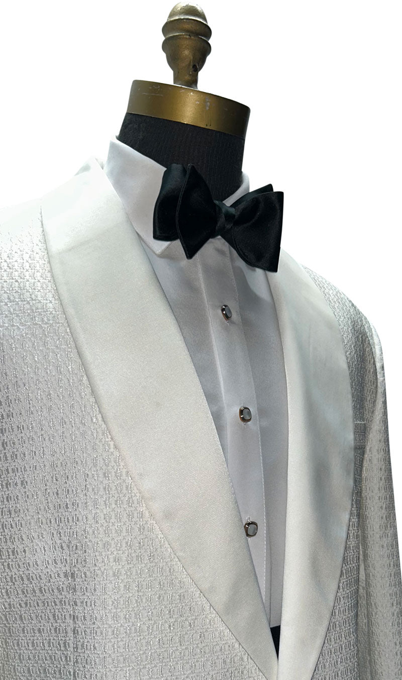 ivory shawl collar tuxedo with texture on a mannequin with an ivory tuxedo shirt and a black tie-yourself  bowtie 