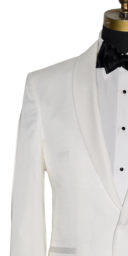 close-up mannequin wearing an ivory shawl collar tuxedo with a white tuxedo shirt and a black  tie-yourself bowtie against a white background