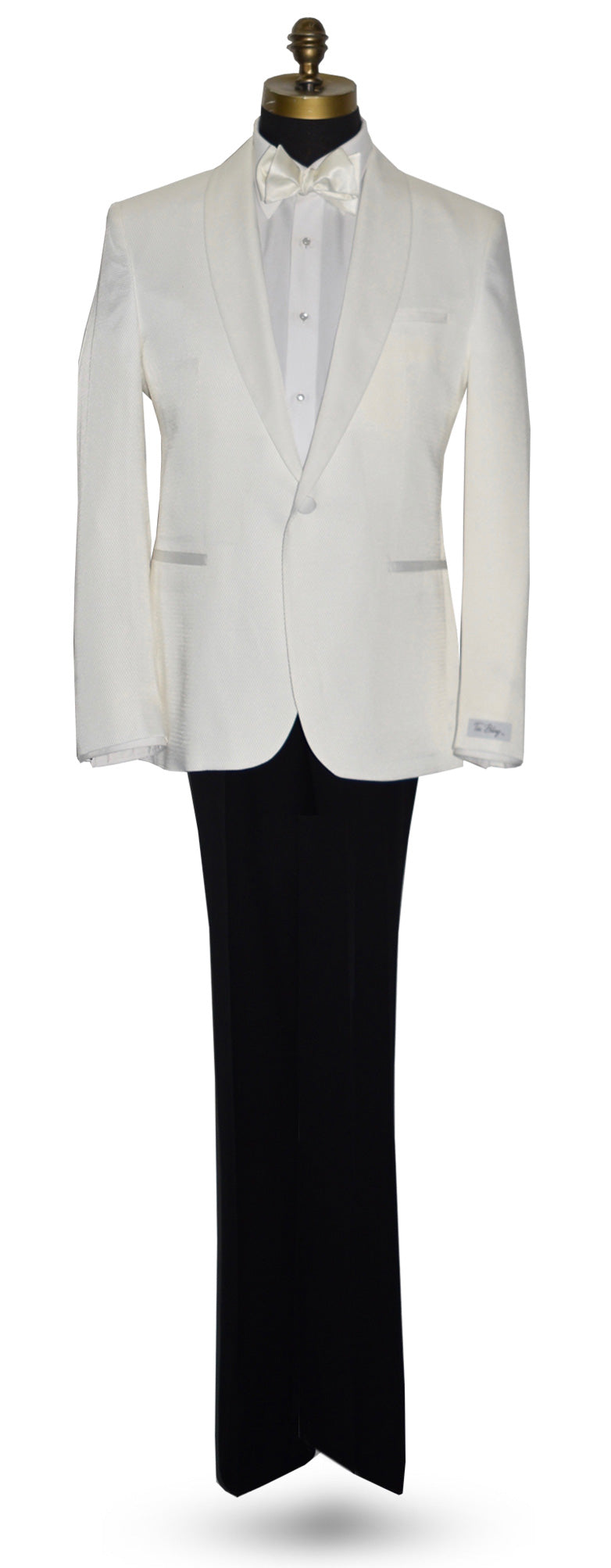 life size mannequin mannequin wearing an ivory shawl collar tuxedo with a white tuxedo shirt and a ivory tie-yourself bowtie against a white background
