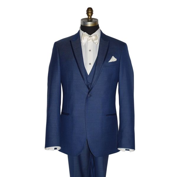 mannequin wearing a blue tuxedo with an ivory tuxedo shirt and an ivory "tie-yourself" bowtie against a white background