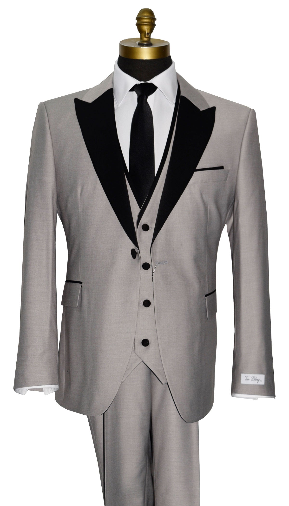 close-up light gray peak lapel tuxedo with gray vest and black long necktie against a white background