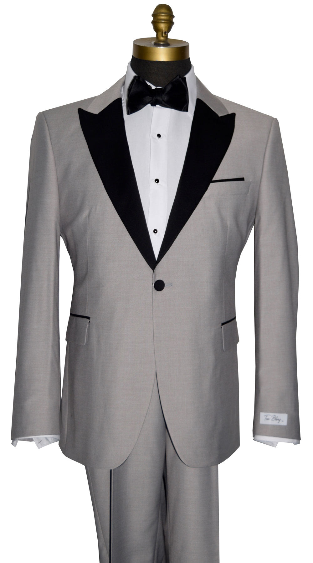 Gray tuxedo with black lapels on a mannequin against a white background