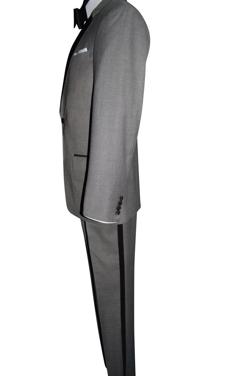 Close up side view of a mannequin wearing a gray tuxedo with black bowtie by San Miguel Formals