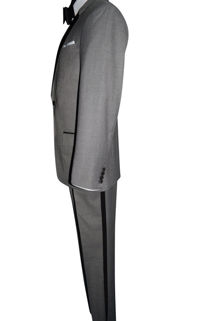 Close up side view of a mannequin wearing a gray tuxedo with black bowtie by San Miguel Formals