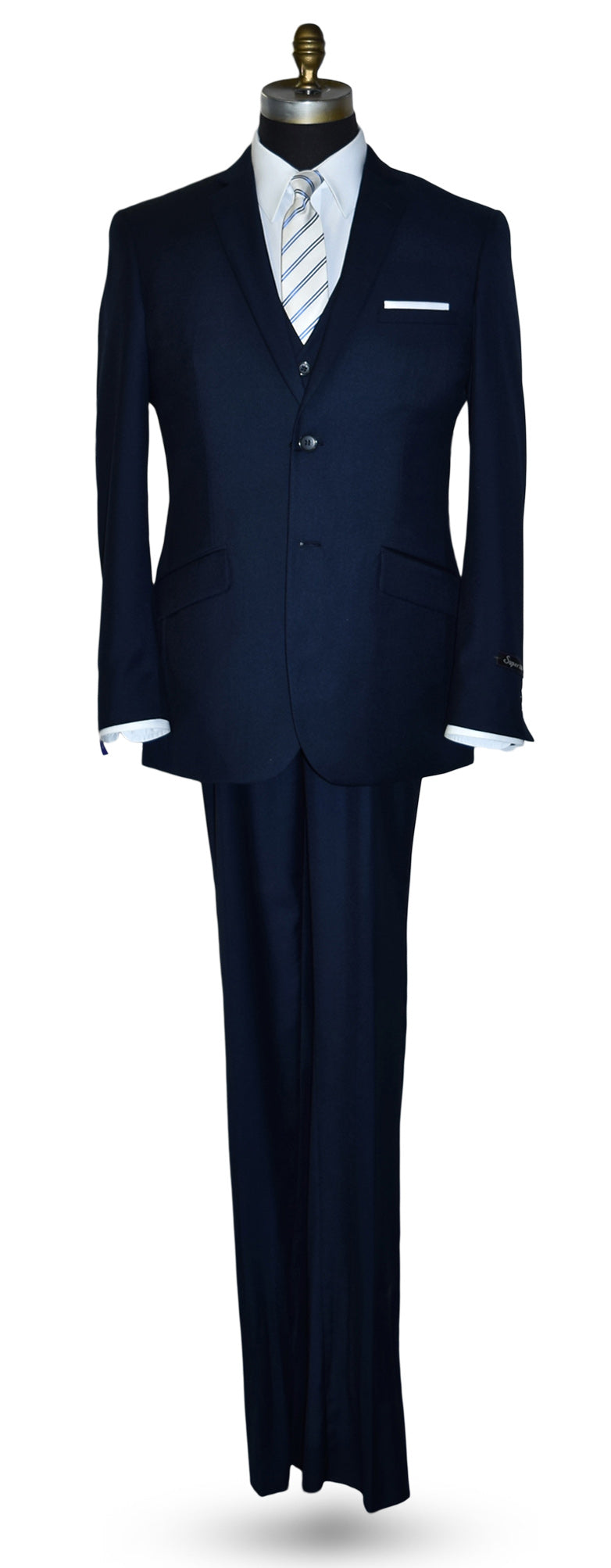 Navy blue suit on a mannequin with a white shirt and tie against a white background