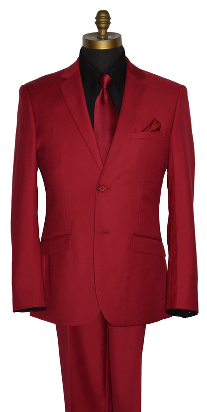 close-up Life size mannequin wearing a red men's suit with a black shirt and a long red necktie with a red pocket handkerchief against a white background