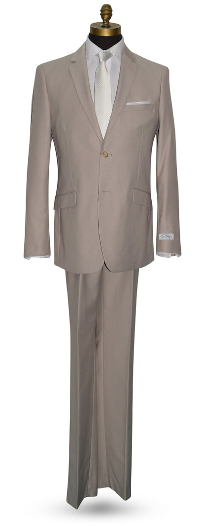 life size mannequin wearing beige mens suit with white long dress tie and "tux bling" branded label against a white background