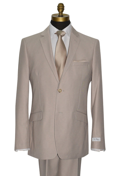 close-up of mannequin wearing beige mens suit with champagne dress tie and a "tuxbling" branded label  against a white background
