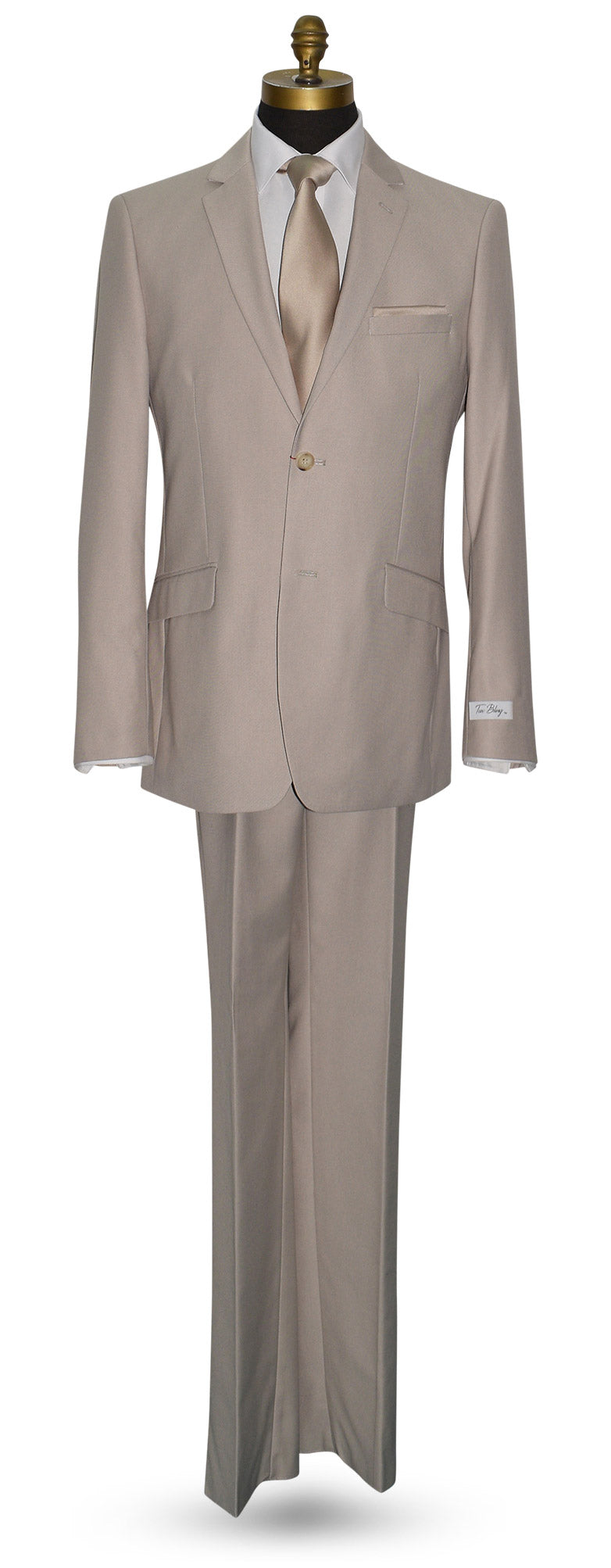 fancy beige suit on a mannequin against a white background