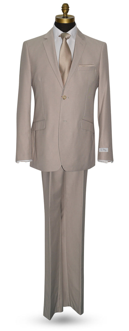 fancy beige suit on a mannequin against a white background