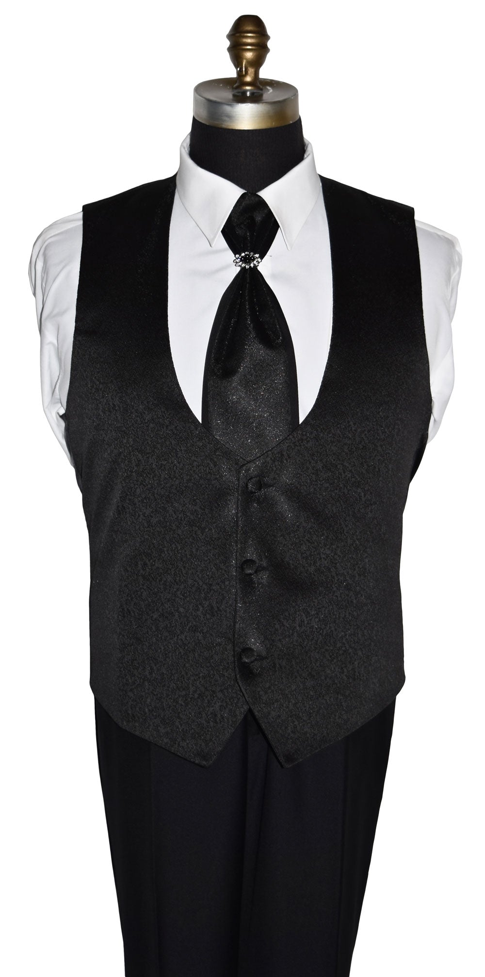 Black nehru vest with a white shirt and black tie on a mannequin against a white background