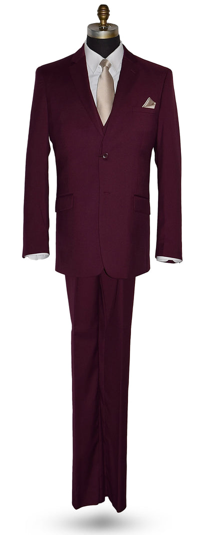 life size mannequin wearing a burgundy 3-piece suit with a white dress shirt and a tan necktie and pocket handkerchief in front of a white background