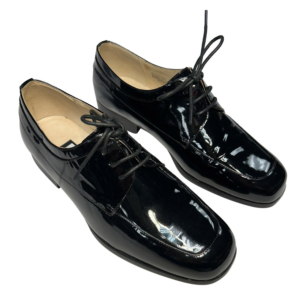 Pair of black patent leather shoes on a white background