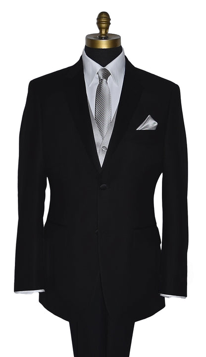 Black suit jacket with a white shirt and moonlight-gray vest with a striped moonlight-gray necktie and pocket handkerchief on a mannequin against a white background
